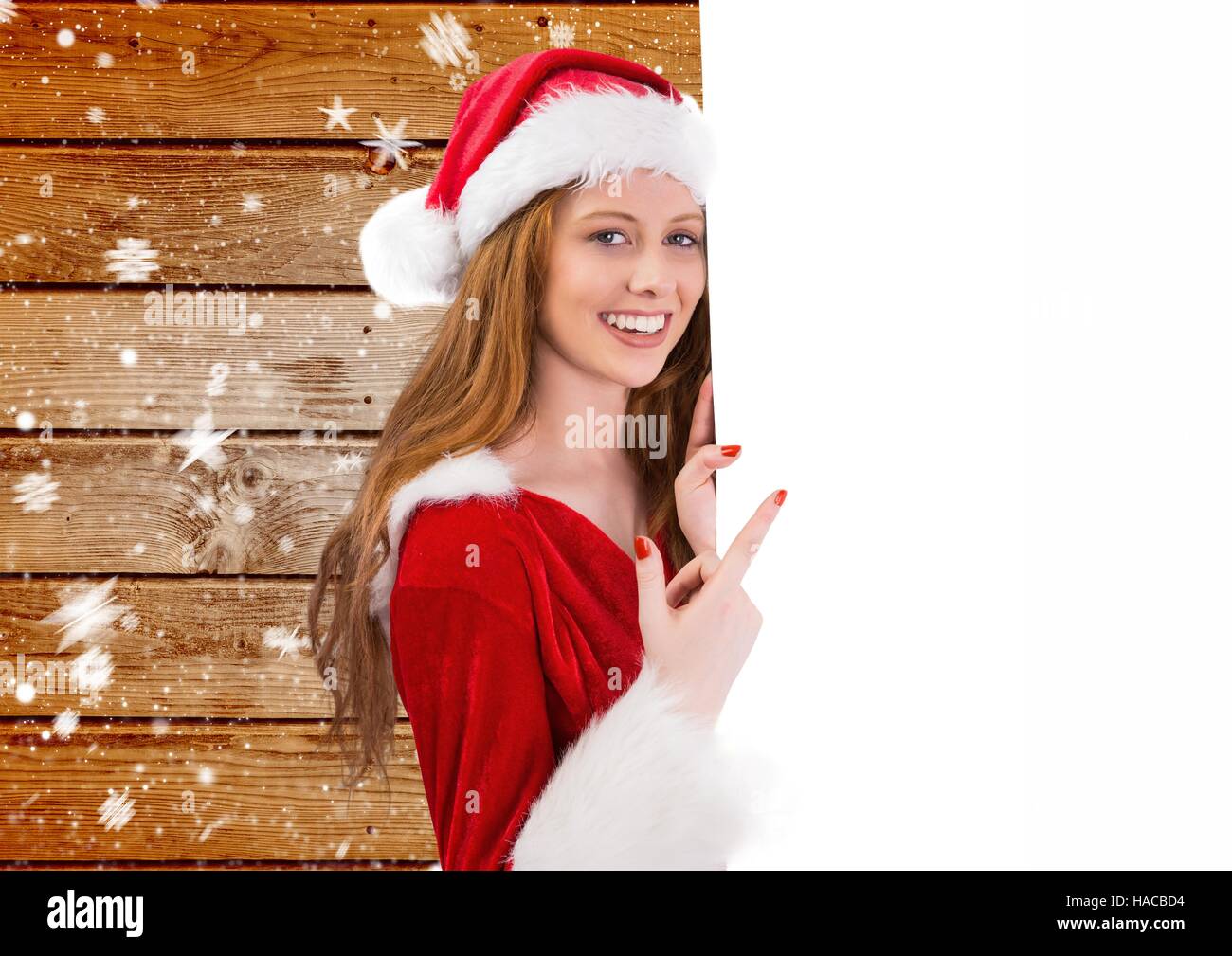 Bella donna in costume di santa puntando sulla targhetta Foto Stock