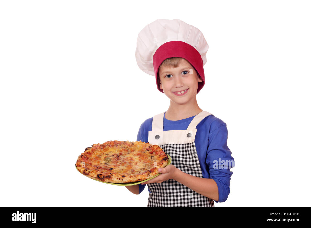 Immagini Stock - Ragazzino In Cappello Da Cuoco E Un Grembiule Che Cucina  Pizza In Cucina. Bambino Che Aggiunge Il Formaggio Alla Pizza. Image  160606273