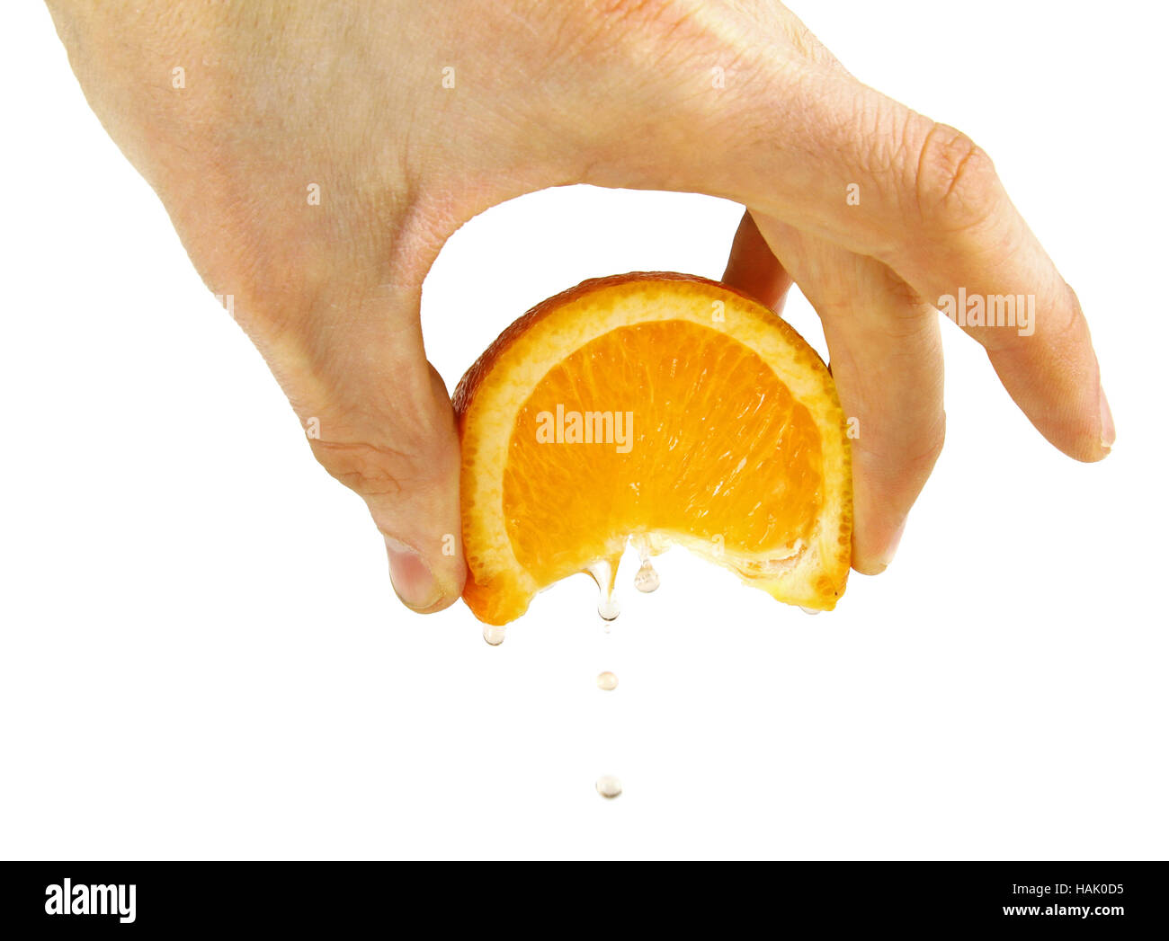 Squeeze arancione in mano, isolato su un bianco Foto Stock