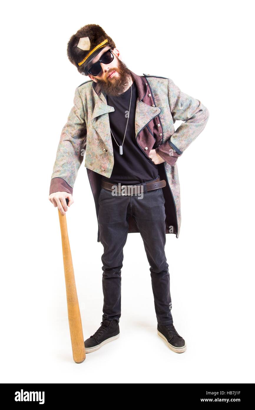 Funny Man vestito stranamente tenendo un bat. Foto Stock