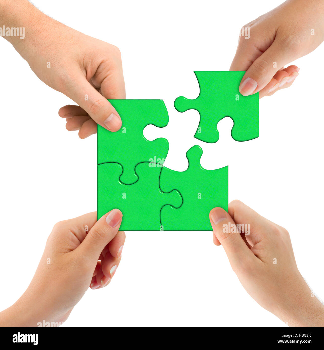 Mani e puzzle Foto Stock