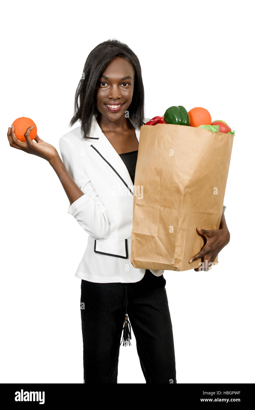 Donna negozi di generi alimentari Foto Stock