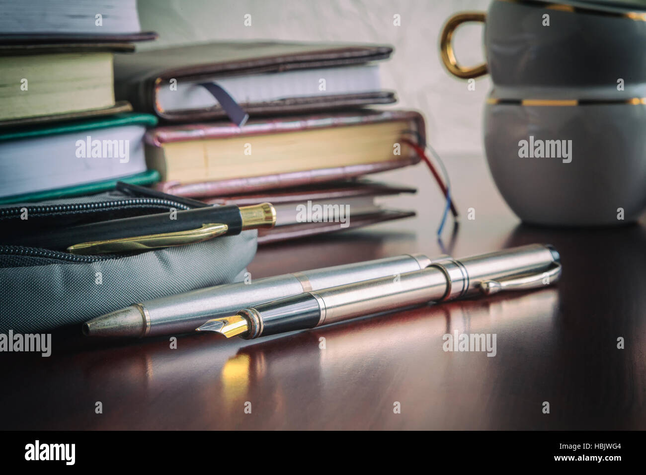 Libri, penne, caffè Foto Stock