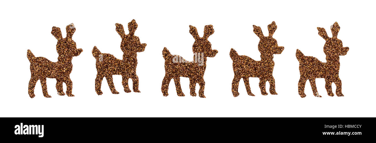Una fila di marrone glitter adesivi di renne isolate su uno sfondo bianco. Foto Stock