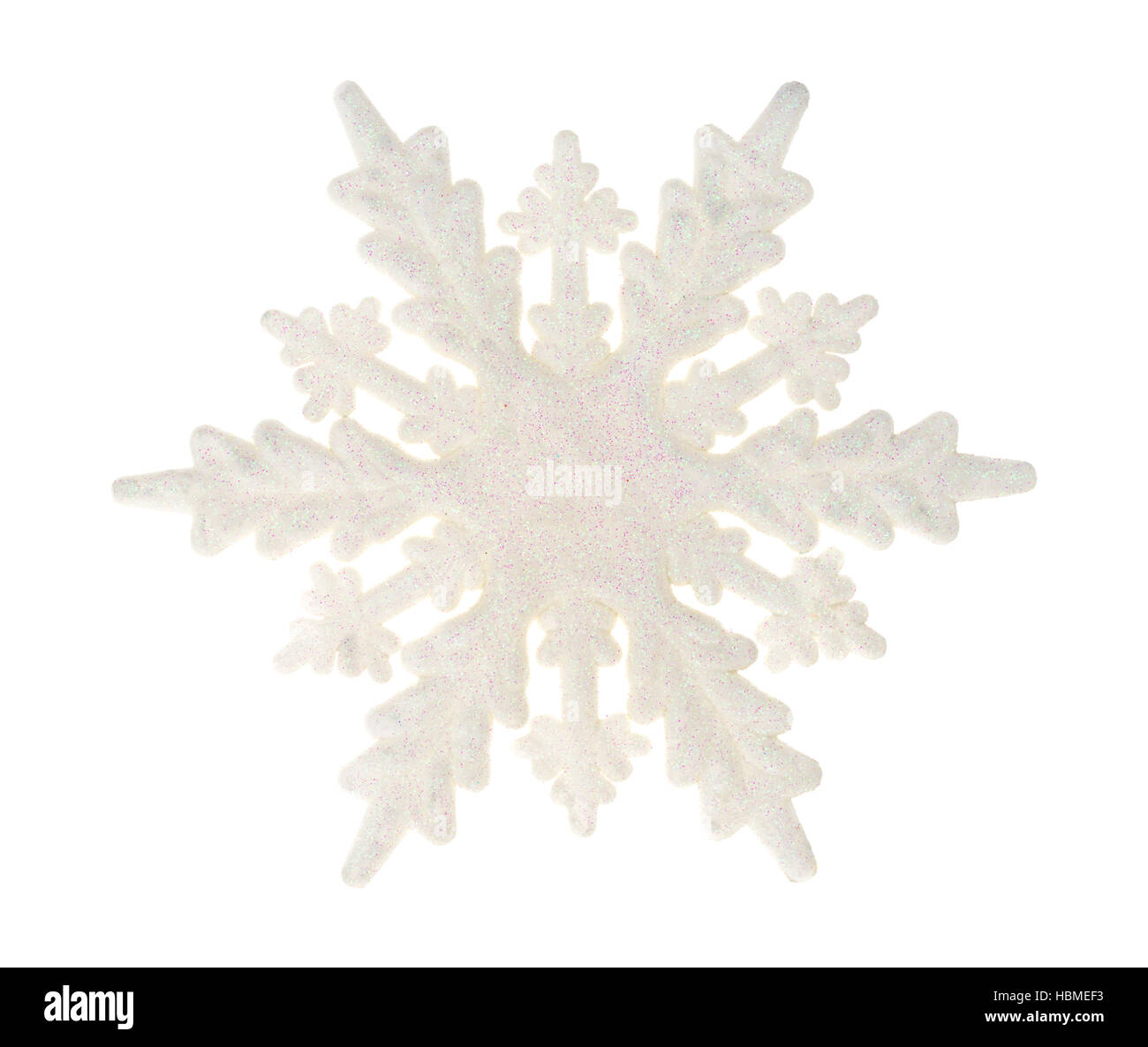 Un grande plastico con il simbolo del fiocco di neve glitter isolato su uno sfondo bianco. Foto Stock