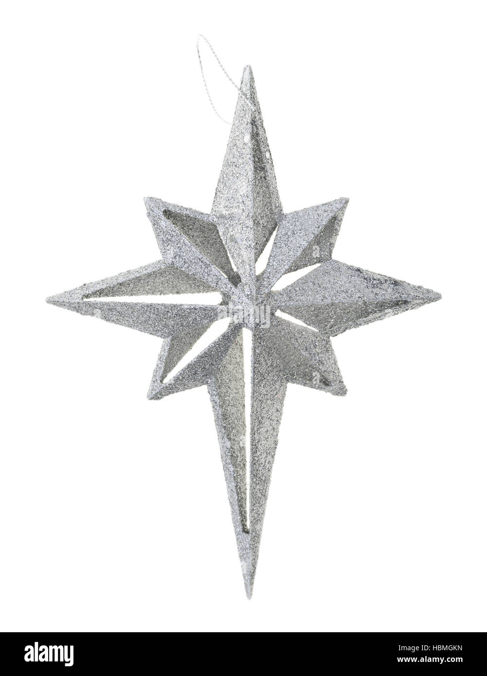 Un grande in plastica a forma di stella ornamento ricoperta con argento glitter isolato su uno sfondo bianco. Foto Stock