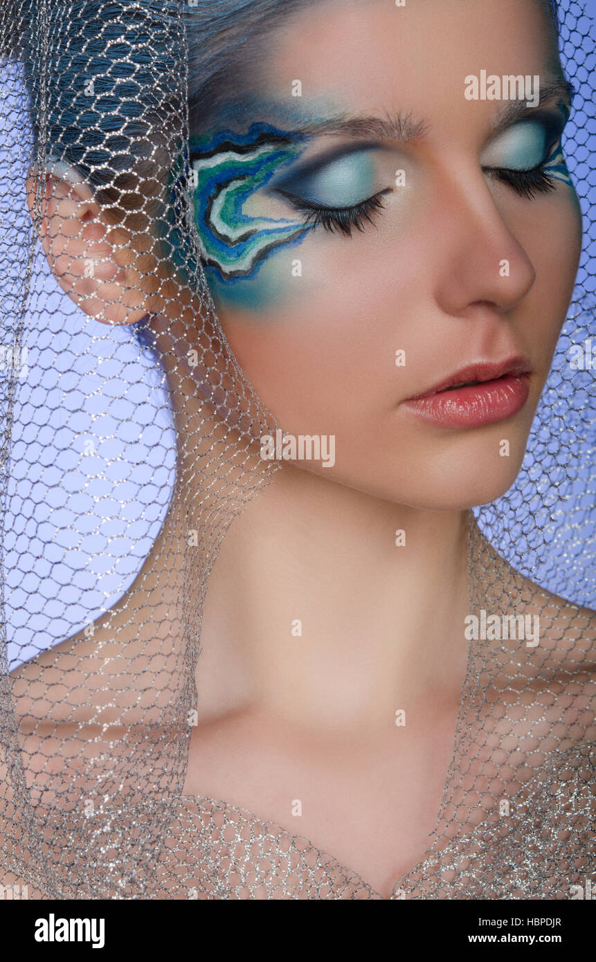 Donna con faccia arte mermaid Foto Stock
