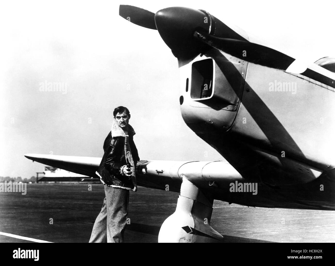 Ali di pericolo (aka morto in corso), Zachary Scott, 1952 Foto Stock