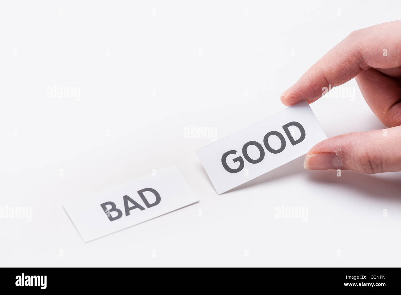 Mano che trattiene la parola di buona, non male Foto Stock