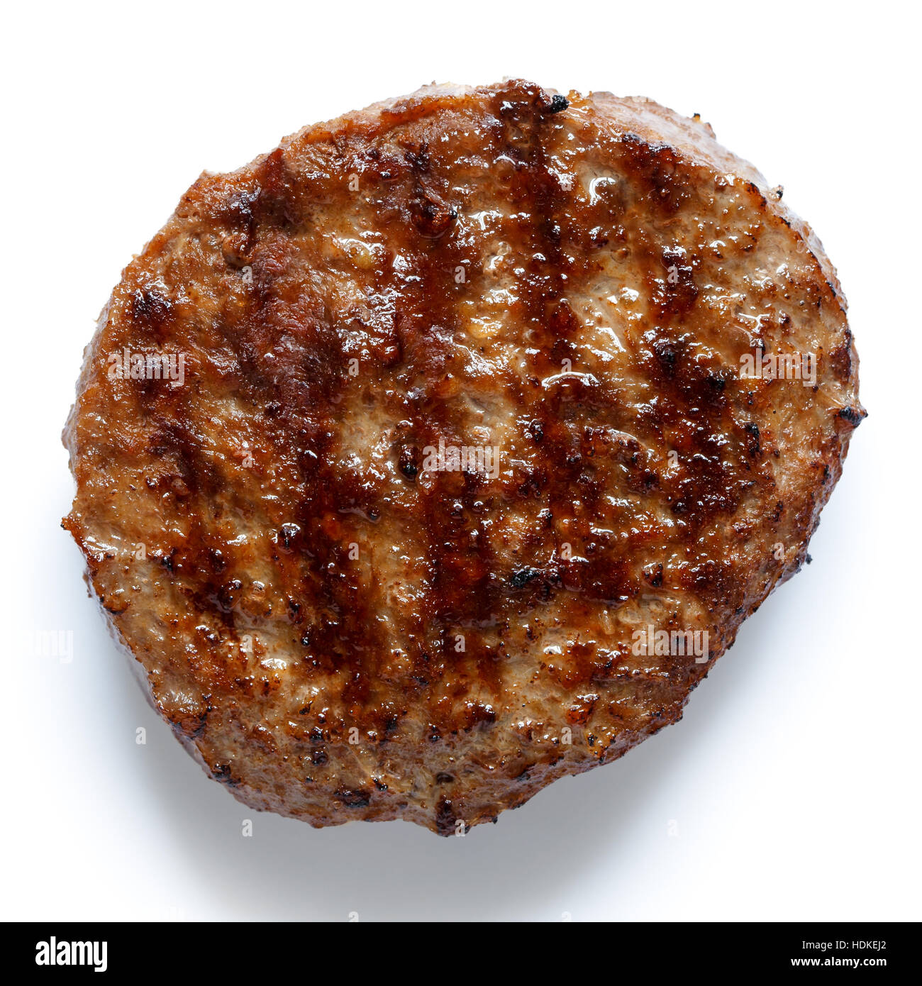 Unico hamburger grigliati patty isolato su bianco dal di sopra. Foto Stock
