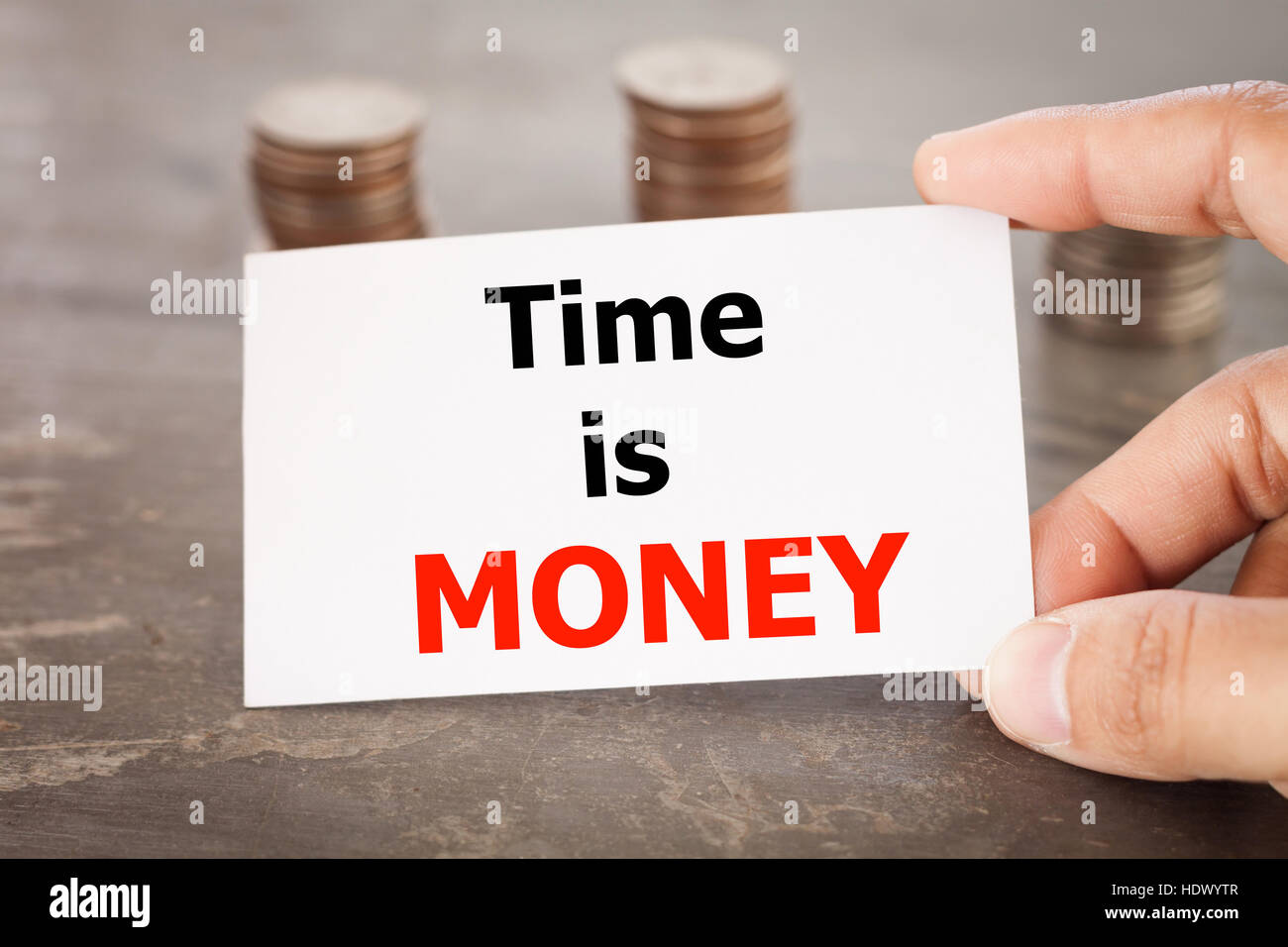 Il tempo è denaro inspirational preventivo su nome scheda con le monete Foto Stock