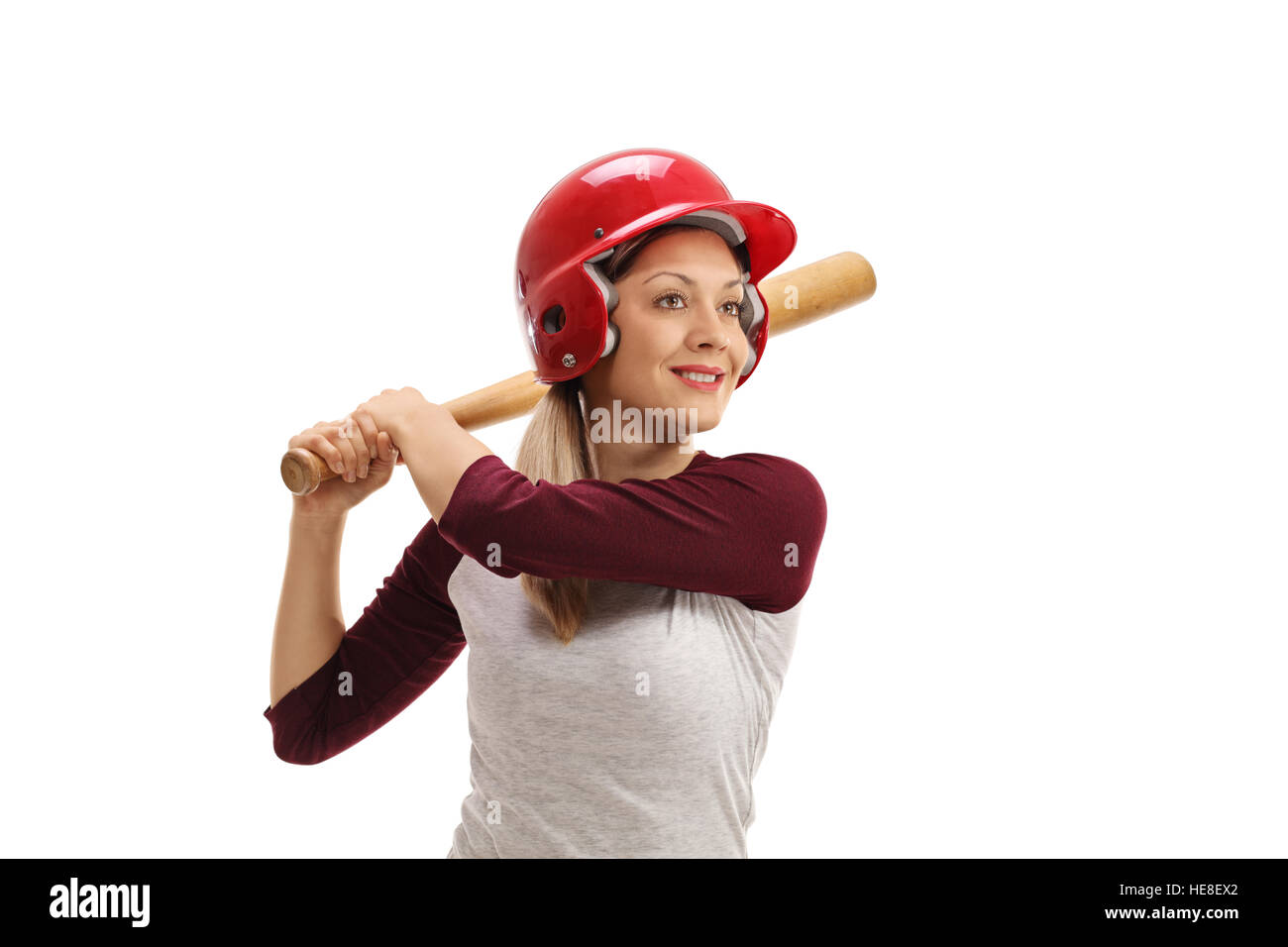 Femmina giocatore di baseball con un mazzuolo di legno pronti a colpire isolati su sfondo bianco Foto Stock