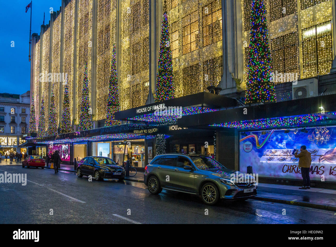 Luci di Natale all'entrata del grande magazzino House of Fraser sulla Oxford St di Londra al tempo di Natale Oxford St, Londra, Regno Unito Foto Stock