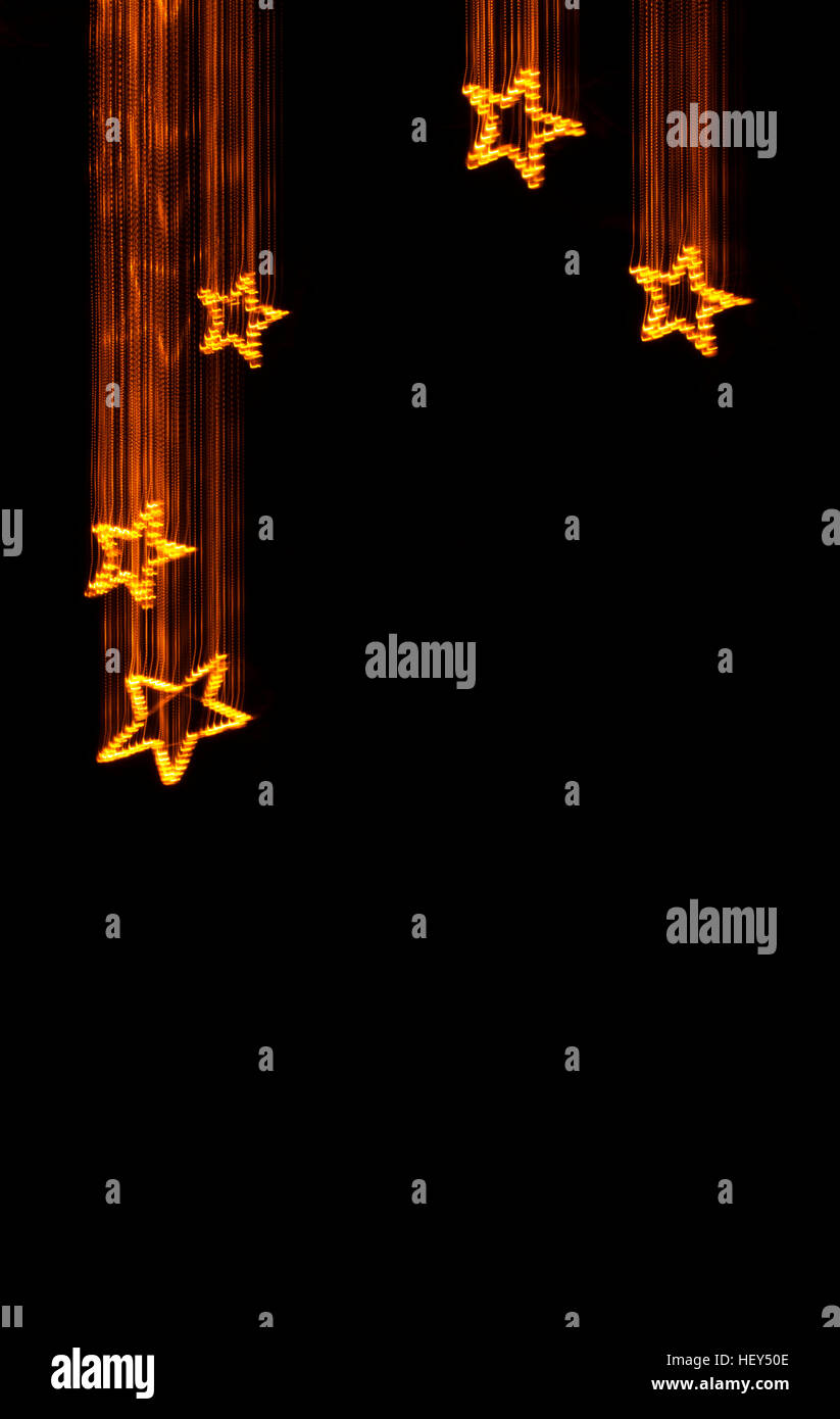 A forma di stella di Natale decorazione a forma di stella cadente dalla luce della pittura. Foto Stock