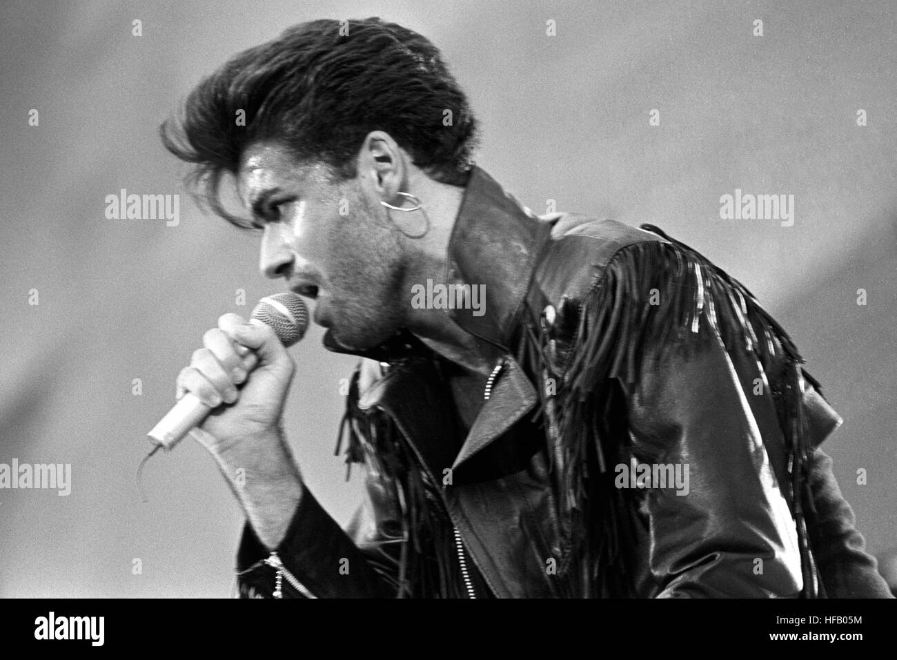 George Michael cantare allo Stadio di Wembley per la Wham! Sell-out concerto di arrivederci. Foto Stock