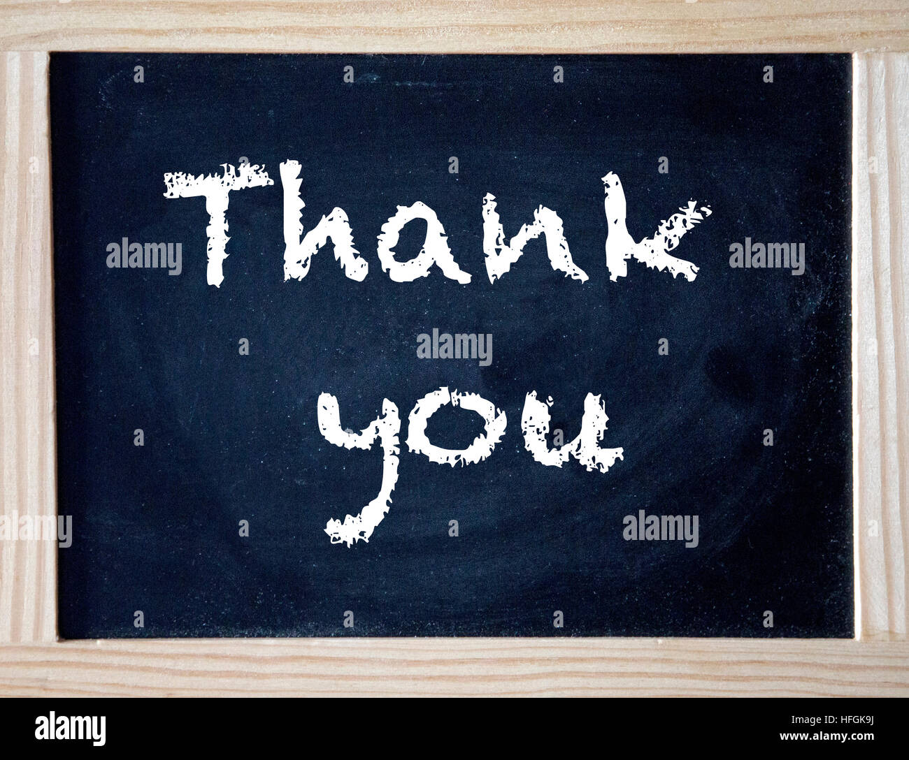 Le parole Grazie scritto su gesso nero board Foto Stock