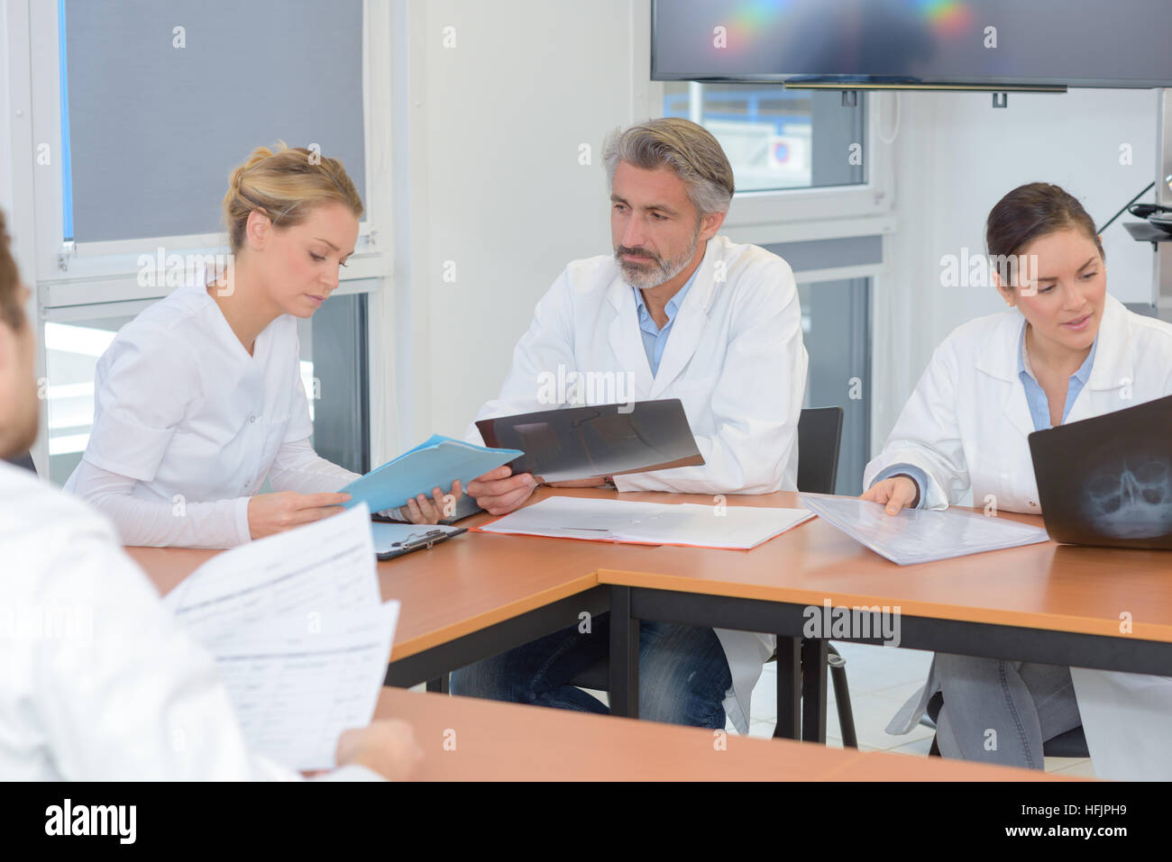 Il personale ospedaliero sale riunioni Foto Stock