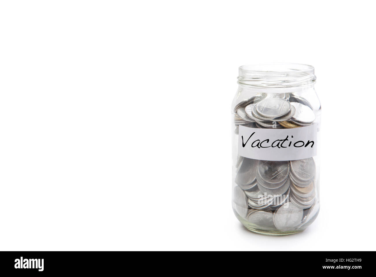 Monete metalliche isolate in vaso con etichetta di vacanza - concetto finanziario Foto Stock
