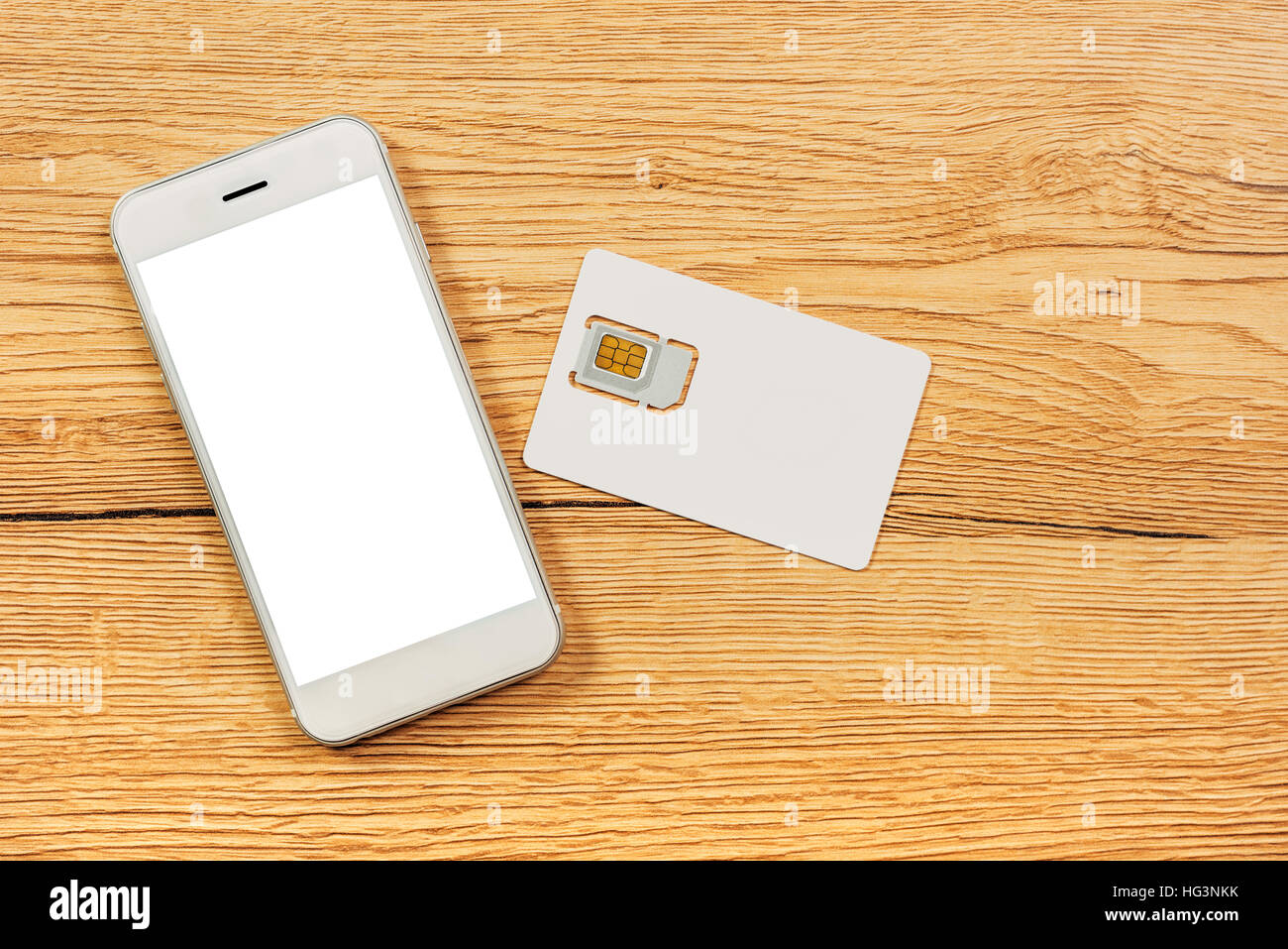 Smartphone con schermo vuoto e scheda SIM sul tavolo, vista dall'alto Foto Stock