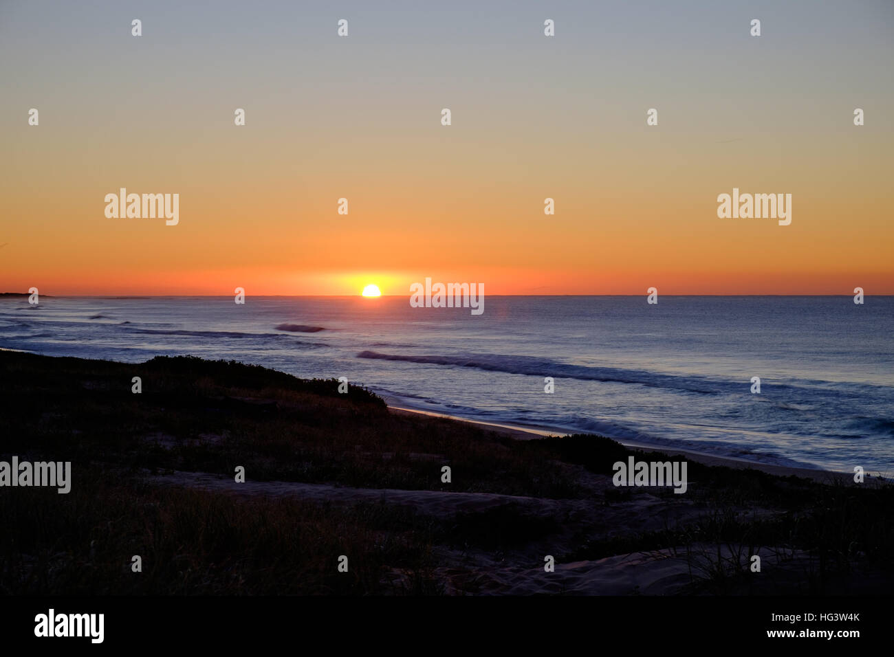 Alba alla spiaggia di Magenta Foto Stock