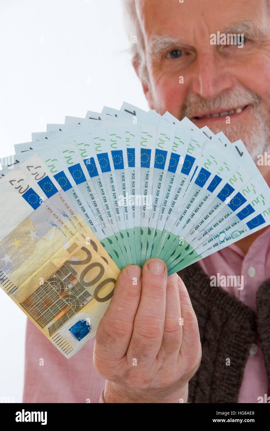 Pensionato con denaro Foto Stock