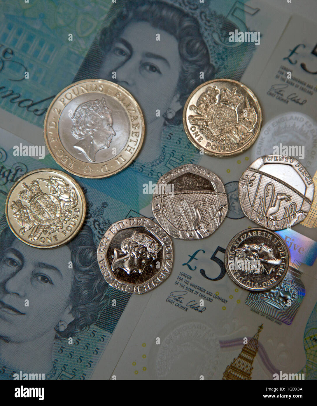 Sterlina inglese delle monete e delle banconote, Londra Foto Stock