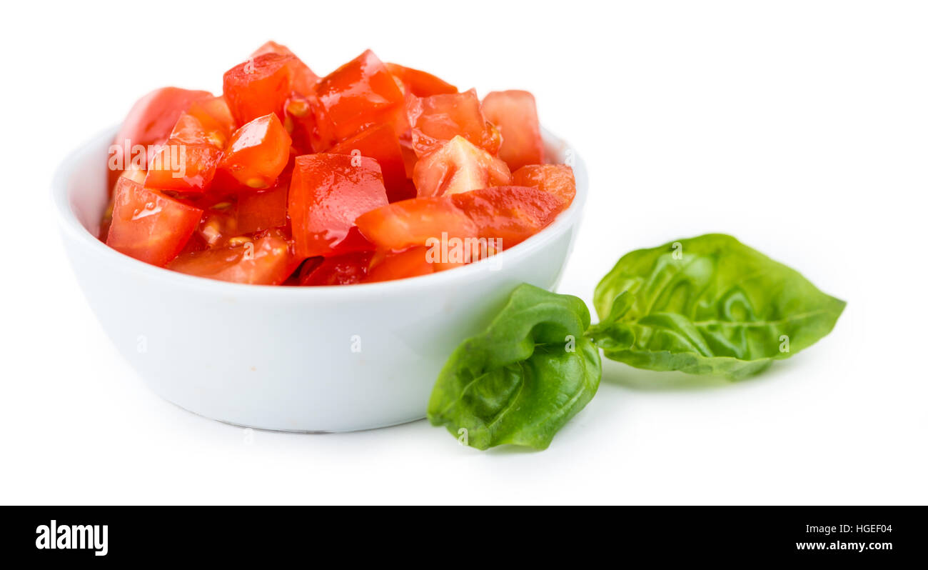 Fatto freschi pomodori (tagliati a dadini) isolato su sfondo bianco (close-up shot) Foto Stock