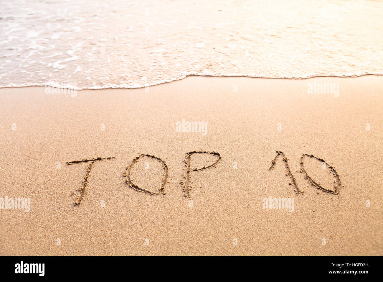 Top 10, segno sulla spiaggia di sabbia Foto Stock