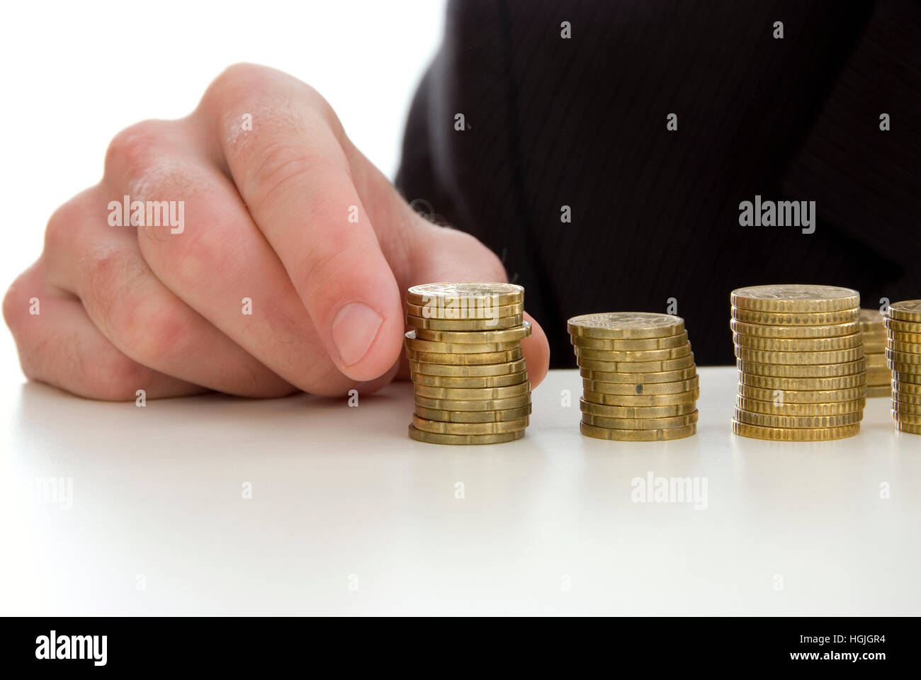 Uomo con le monete Foto Stock