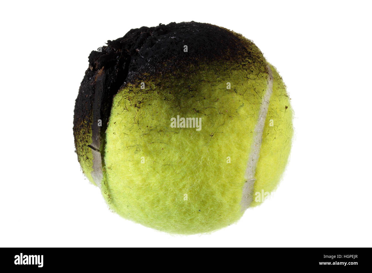 Bruciò palla da tennis Foto Stock