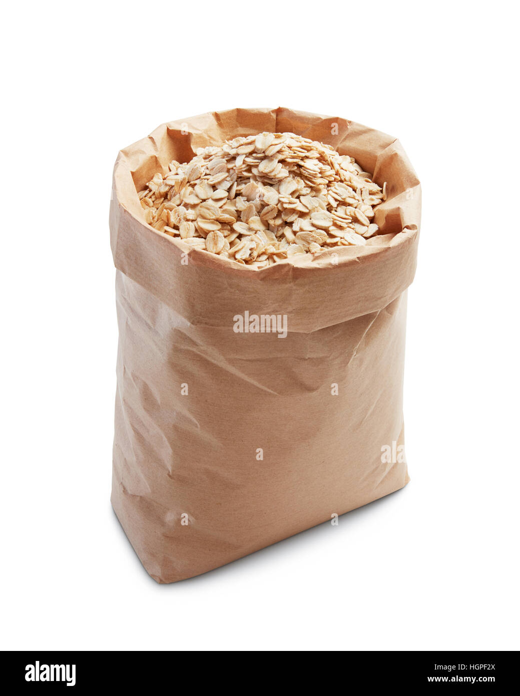 Farina di avena in sacchetto di carta isolato su bianco Foto Stock