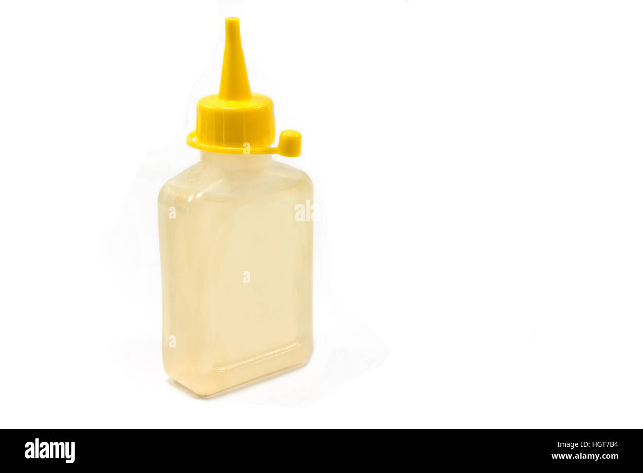 Bottiglia di lubrificazione di olio macchina isolato su bianco Foto Stock
