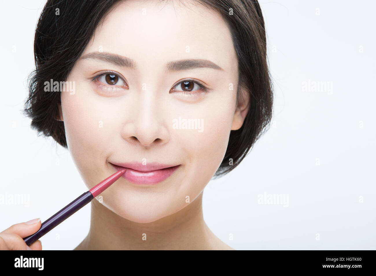 Ritratto di giovane donna sorridente con il rossetto Foto Stock