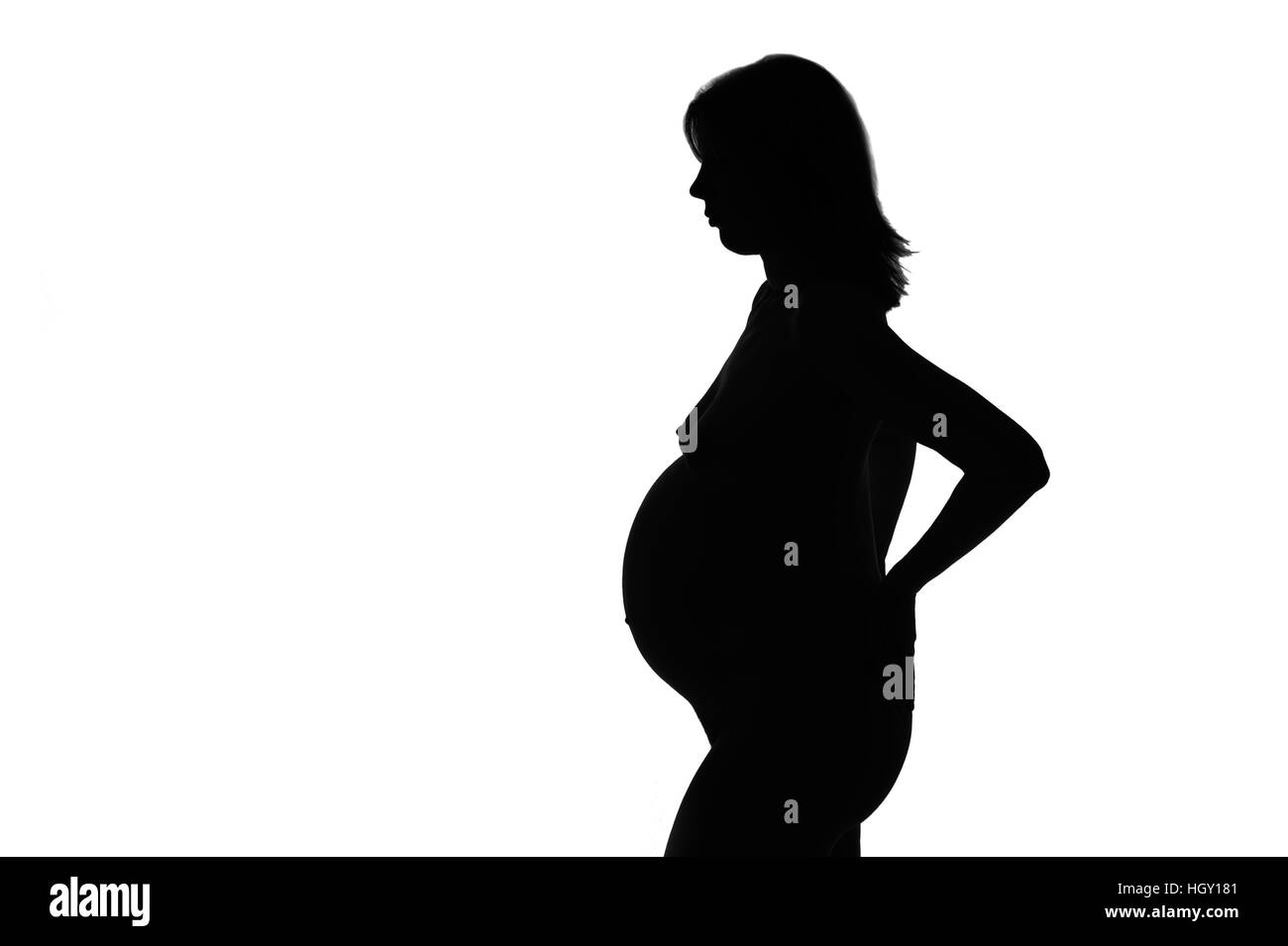 Silhouette di una donna in stato di gravidanza Foto Stock