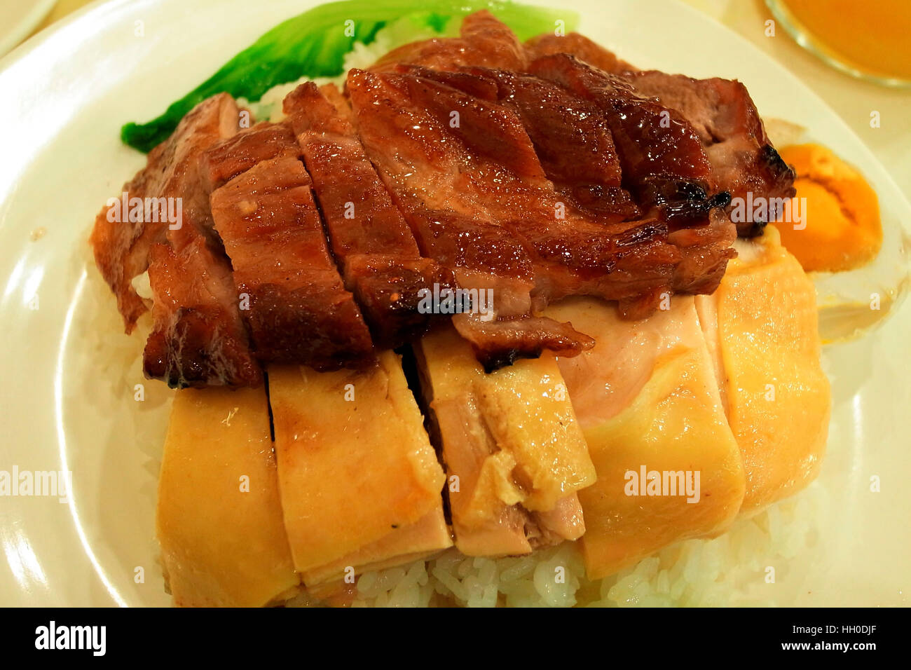 Barbecue di maiale e di pollo a vapore con riso, Hong Kong cibo Foto Stock