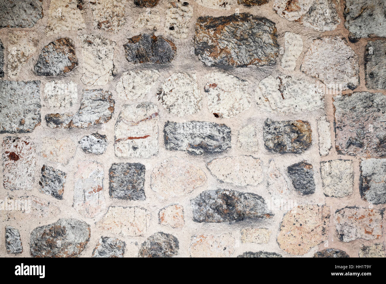 Il vecchio muro di pietra e dettagliate texture di sfondo foto Foto Stock