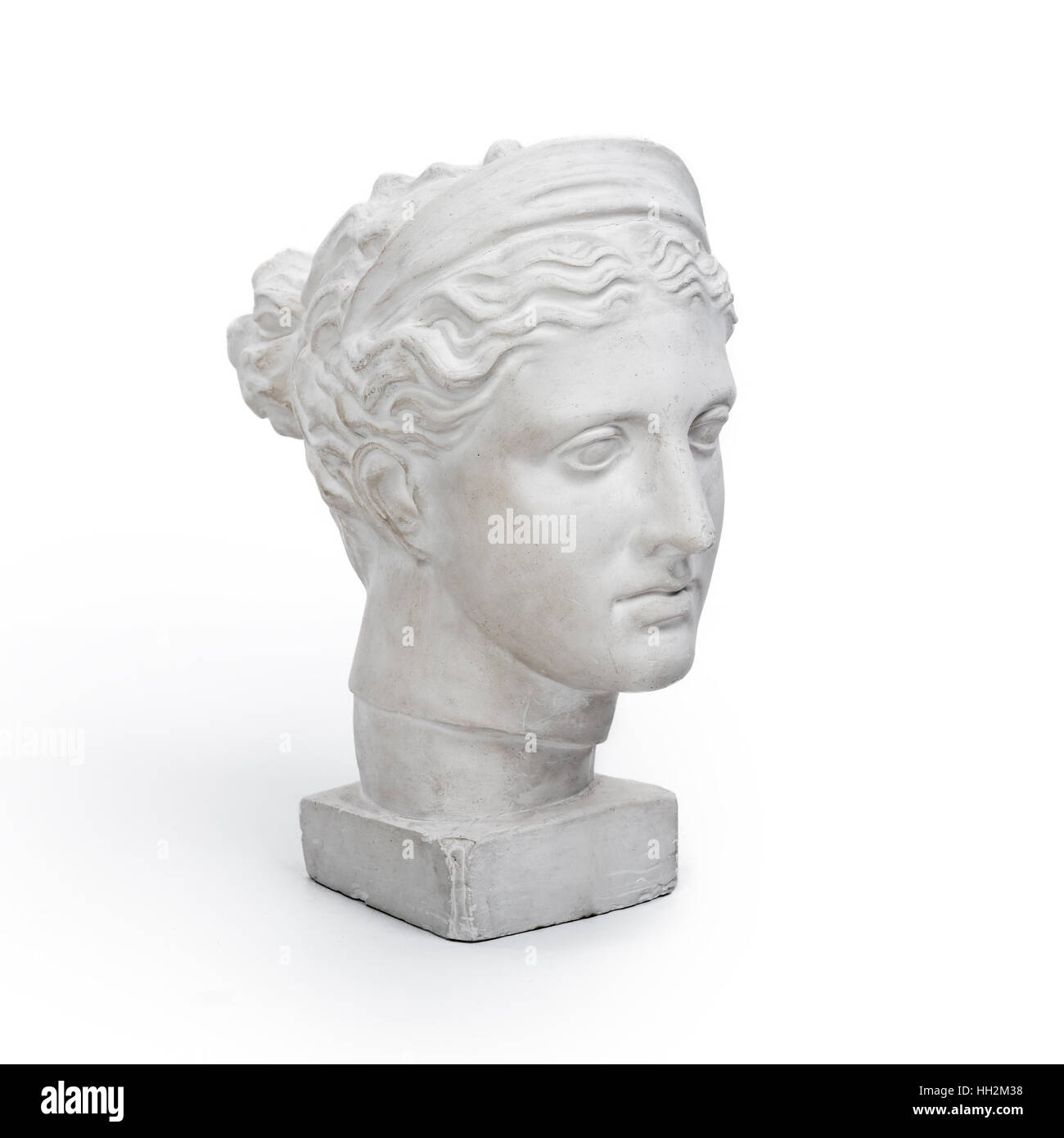 Testa di marmo della giovane donna, antica dea greca busto su sfondo bianco Foto Stock