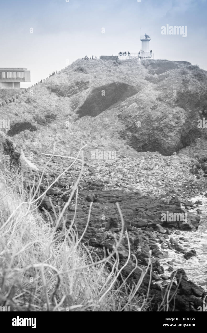 Faro, il bersaglio di treking in Seopjikoji. Si trova alla fine della sponda orientale dell'isola di Jeju, Corea del Sud Foto Stock