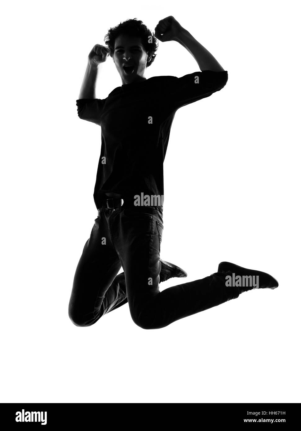 Giovane uomo jumping happy silhouette in studio isolato su sfondo bianco Foto Stock