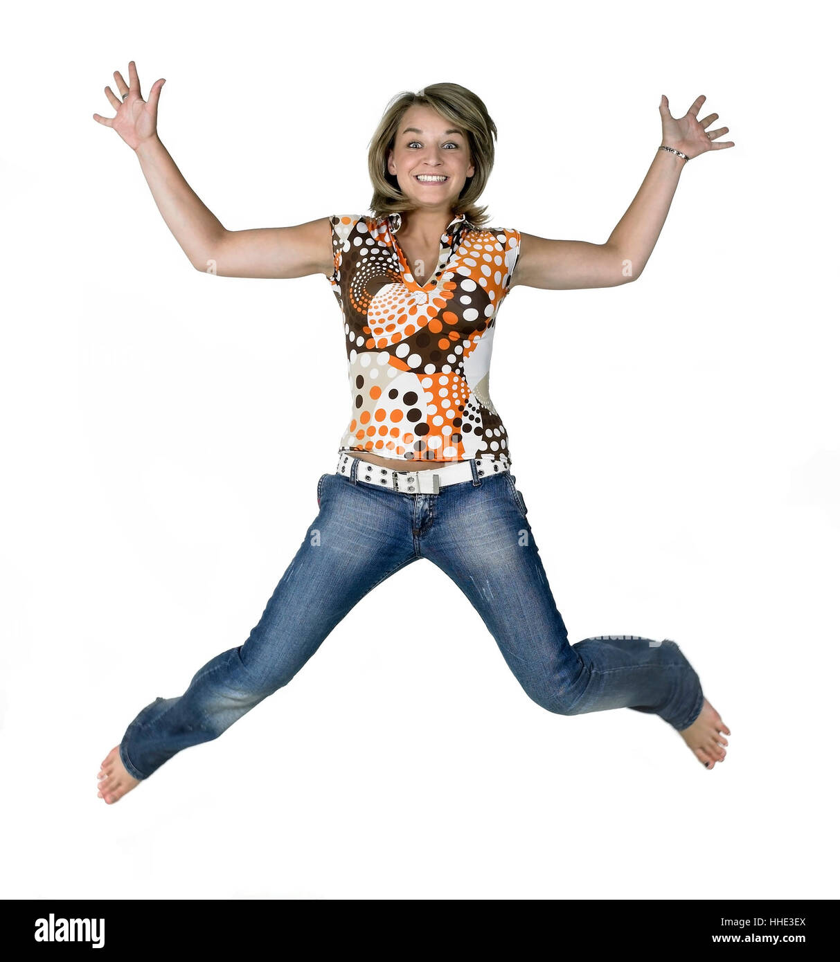 Happy jumping girl isolato su bianco Foto Stock