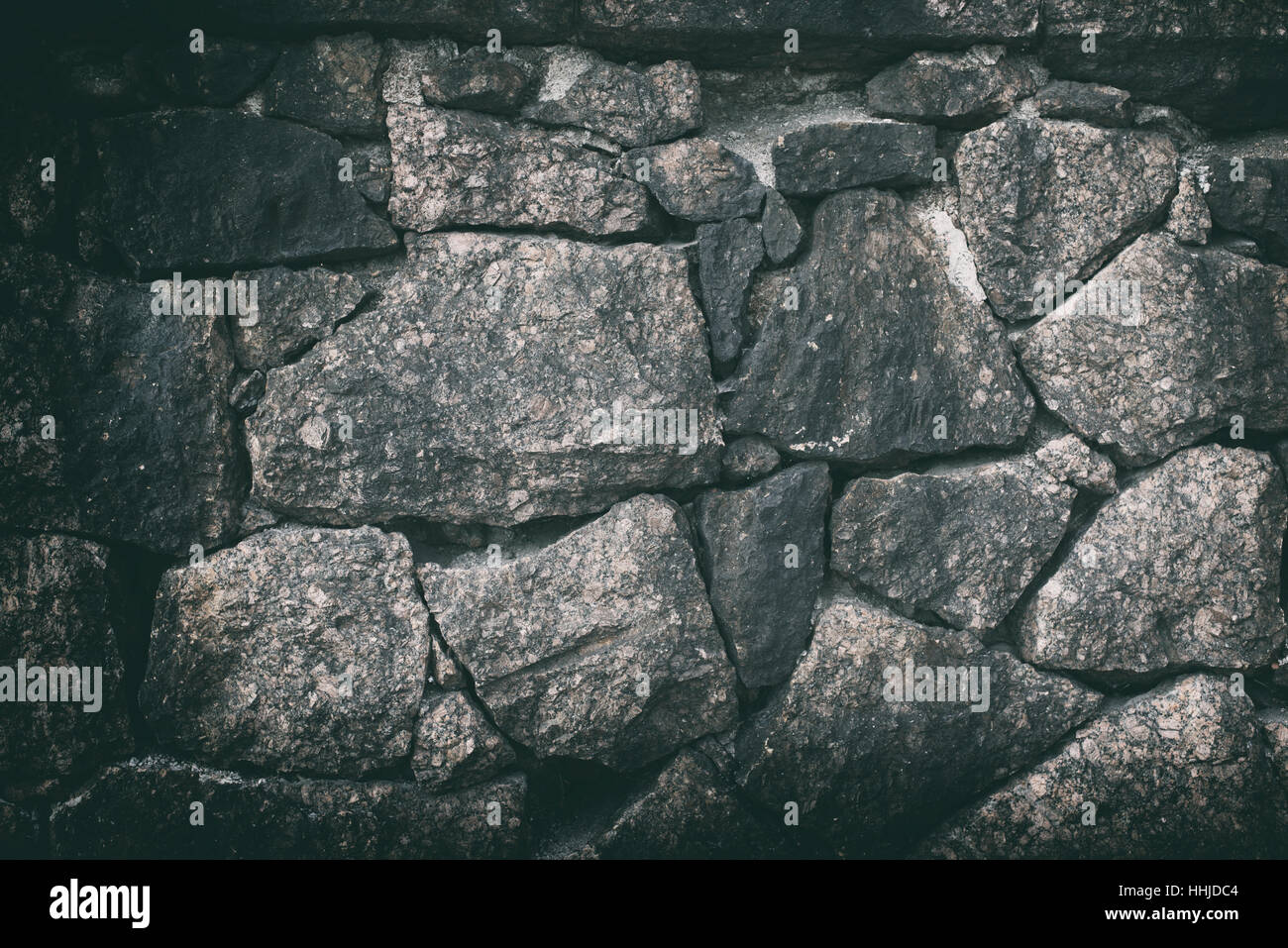 Rotto vecchio muro di pietra naturale texture di sfondo Foto Stock
