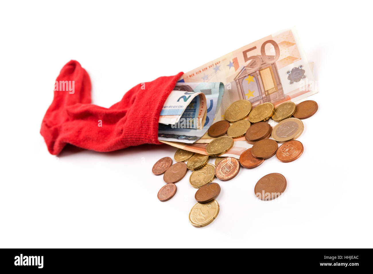 Risparmio di denaro concetto - calza piena di denaro su bianco Foto Stock