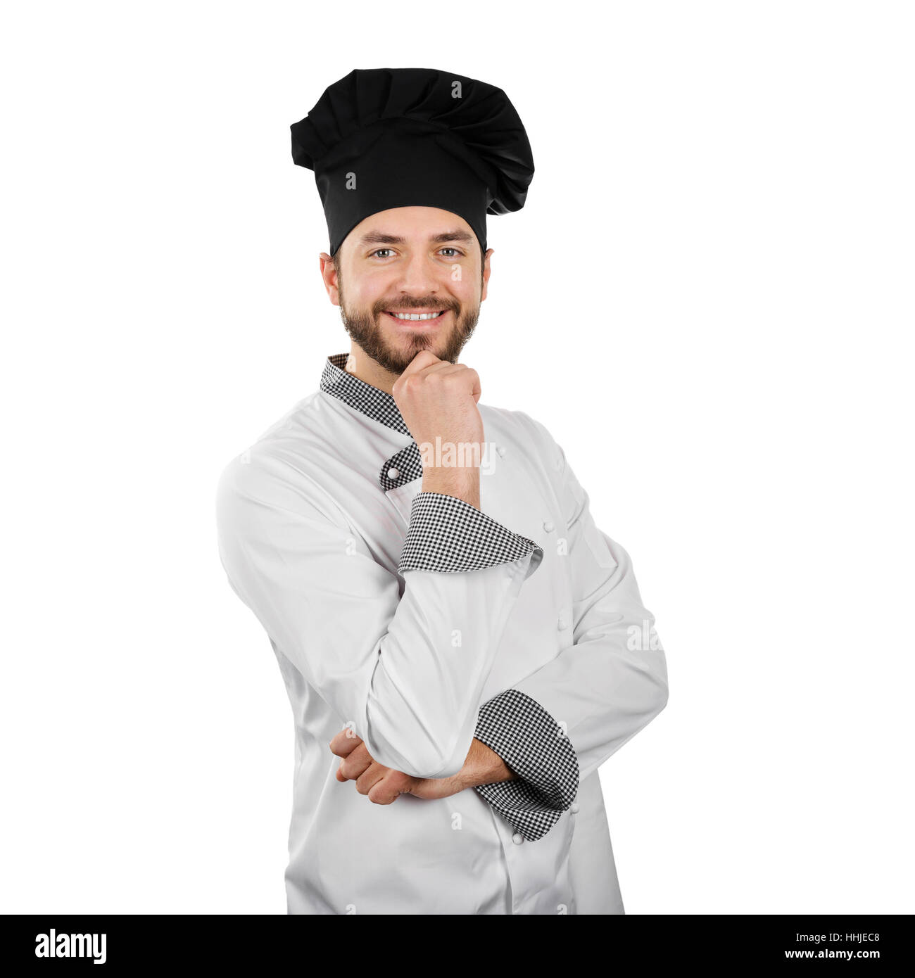 Sorridenti chef con mano sul mento isolato su bianco Foto Stock