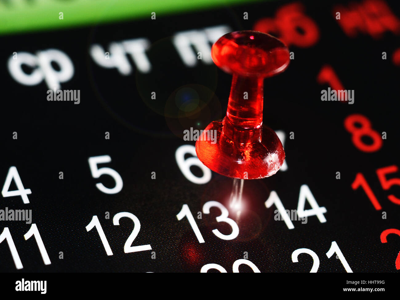 Il pin alla data numero 13 sul calendario. Foto Stock