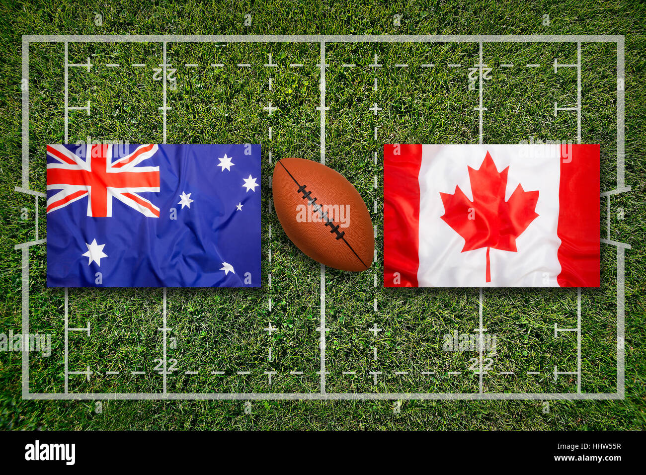 Australia vs. Canada bandiere sul verde del campo di rugby Foto Stock