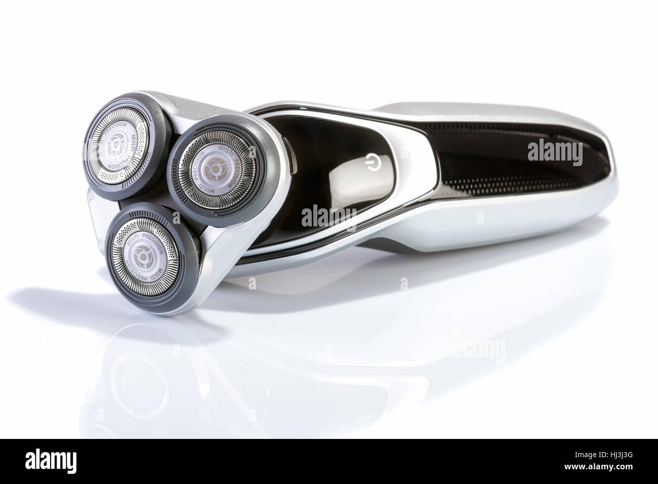 Rasoio elettrico closeup su sfondo bianco. Multi Precision testo scritto sulla testa di rasoio! Migliore precisione per radere! Foto Stock