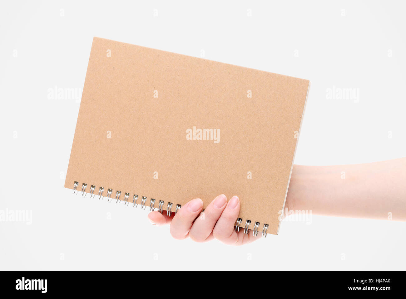 Supporto bianco per notebook a spirale su sfondo bianco Foto Stock