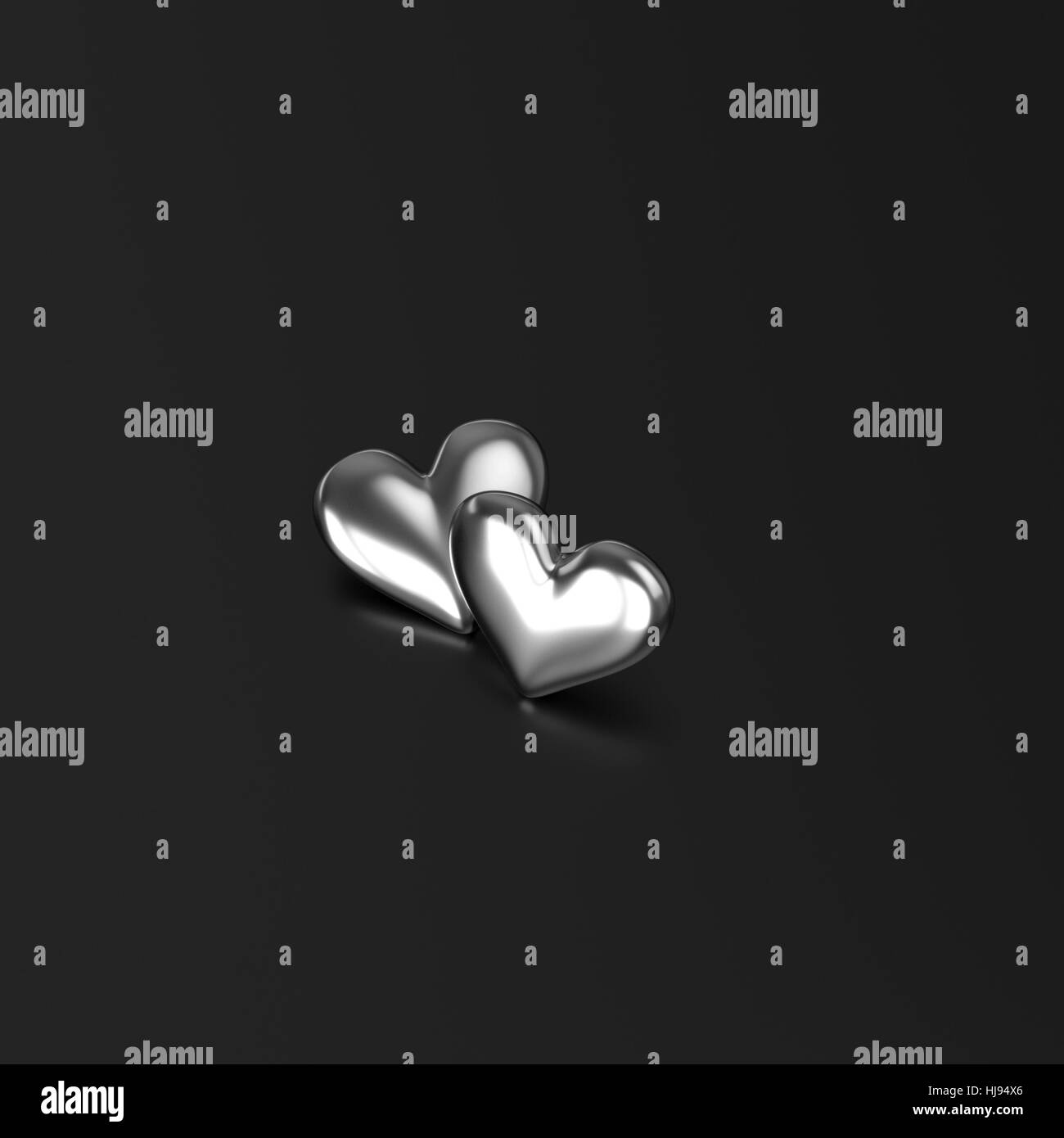 Due d'argento cuore su sfondo nero. Il rendering 3D Foto Stock