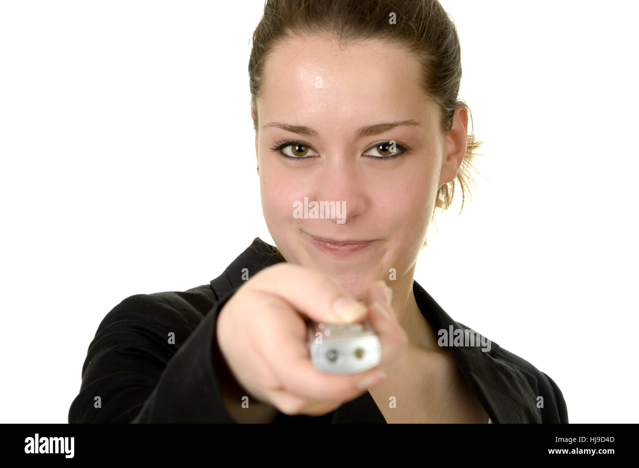 Giovane donna con telecomando / Puntatore laser Foto Stock