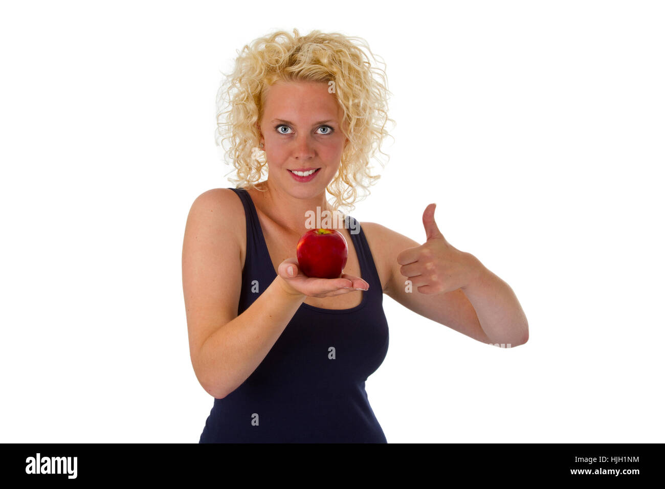 Donna con apple liberamente posizionato su di una superficie bianca Foto Stock